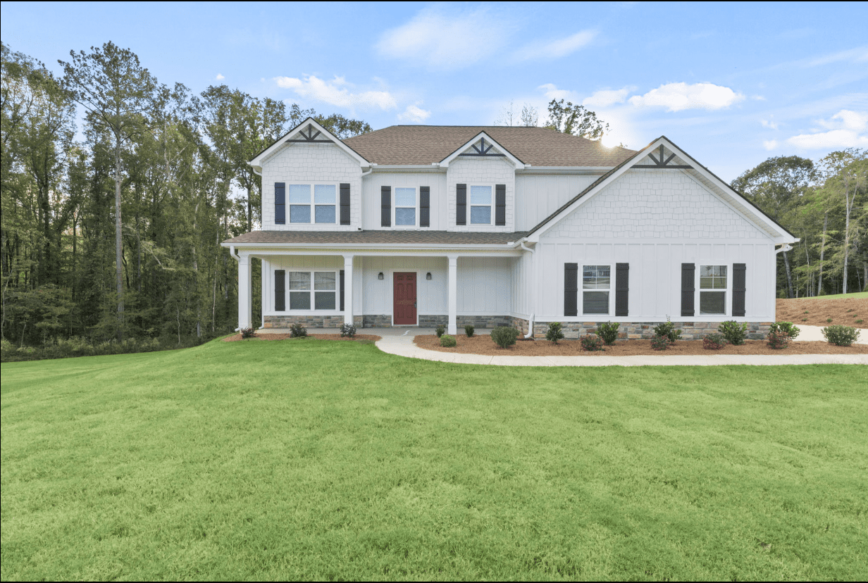 Two-story white house with red door.