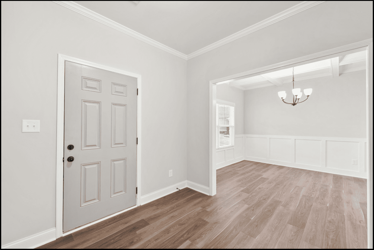 Light gray door and hardwood floors.