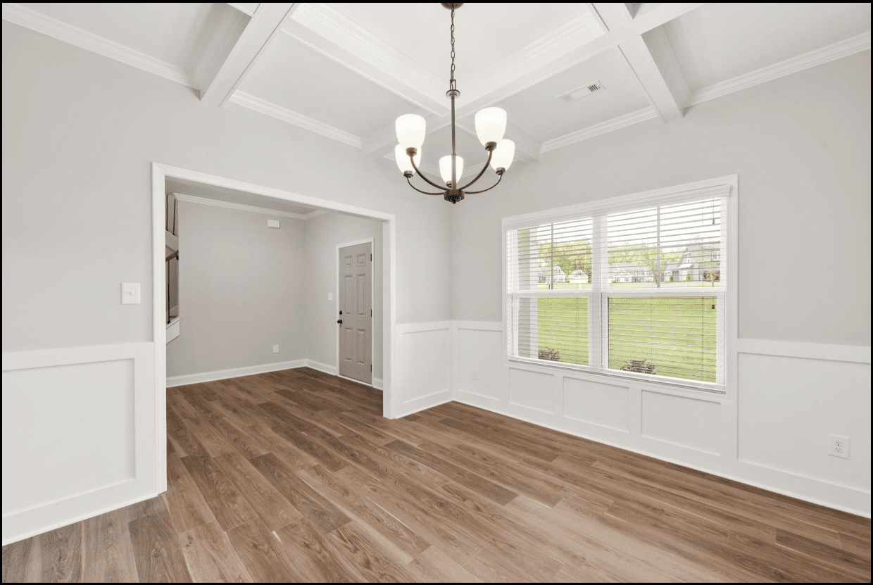 Bright dining room with hardwood floors.
