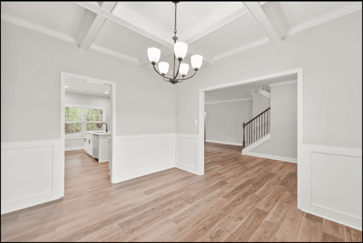 Bright dining room with hardwood floors.