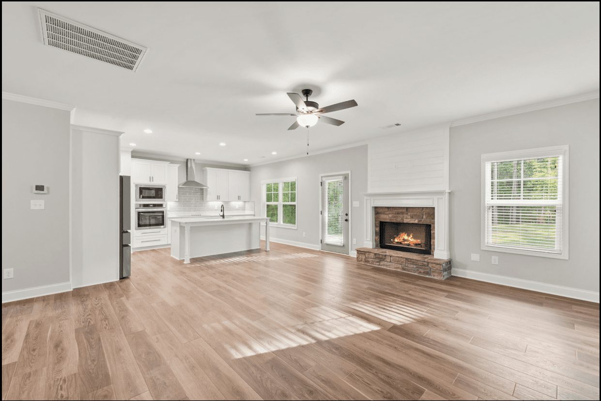 Open-plan home with fireplace and kitchen.