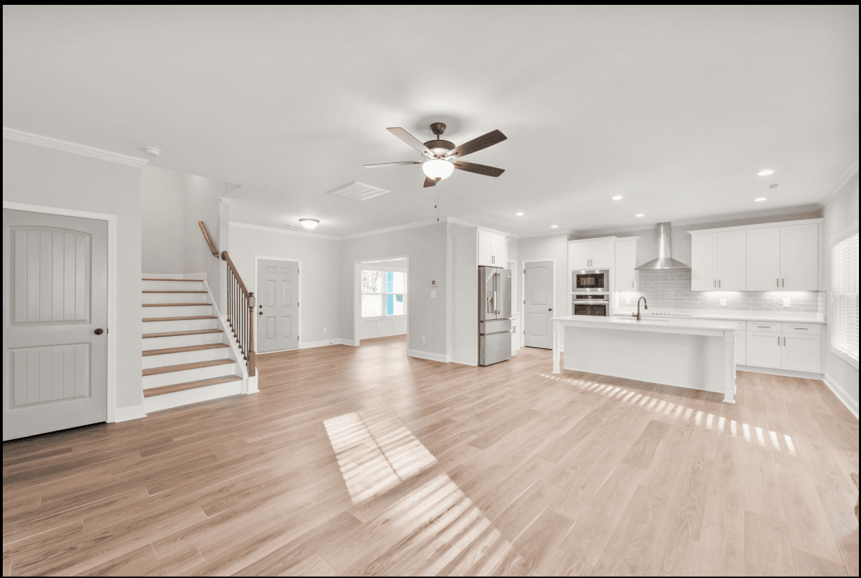 Spacious new home interior with hardwood floors.