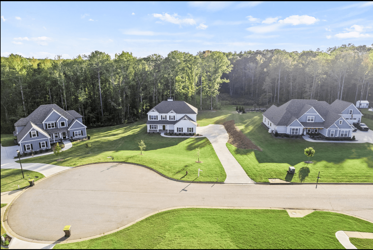 Aerial view of three new houses.