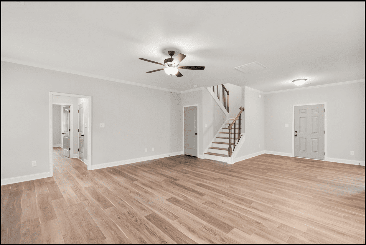 Spacious living room with hardwood floors.