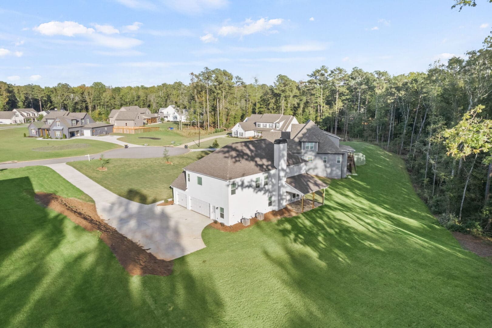 Aerial view of new house and neighborhood.