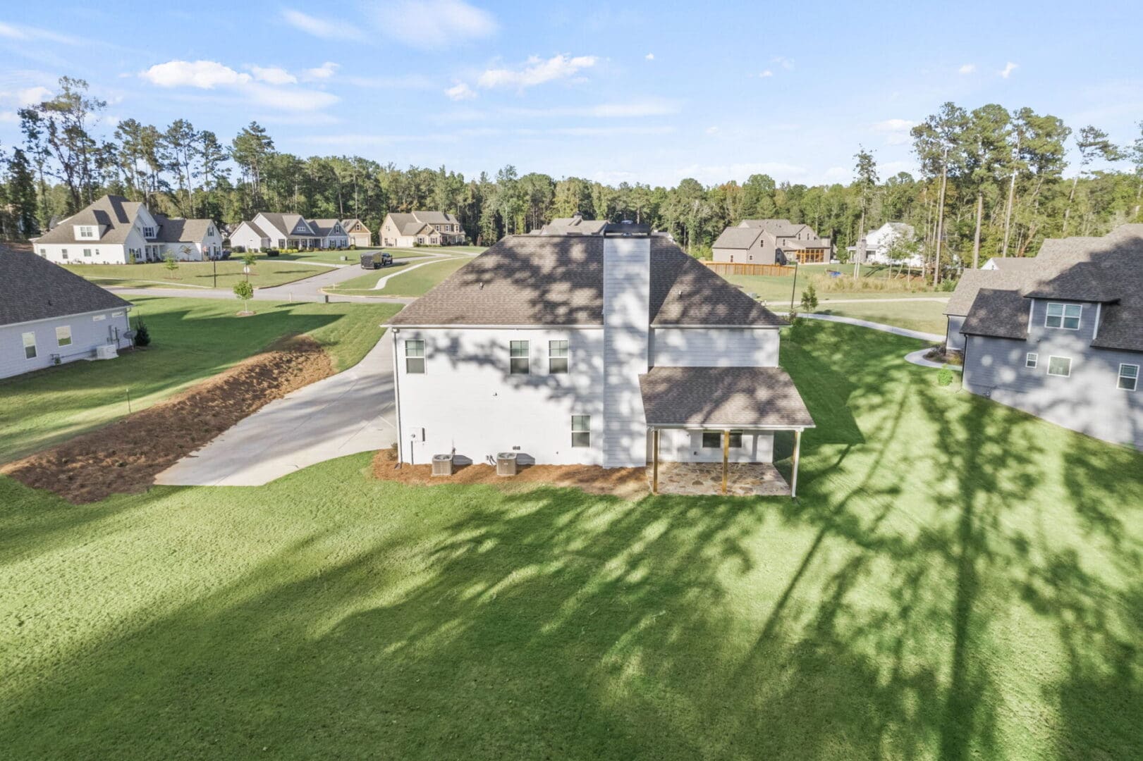 Aerial view of a house with a patio.