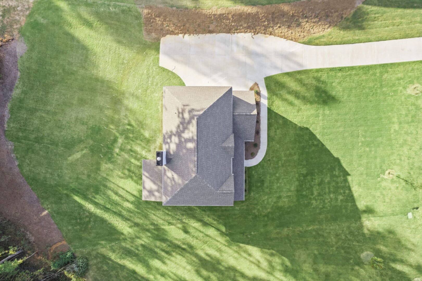 Aerial view of house and lawn.