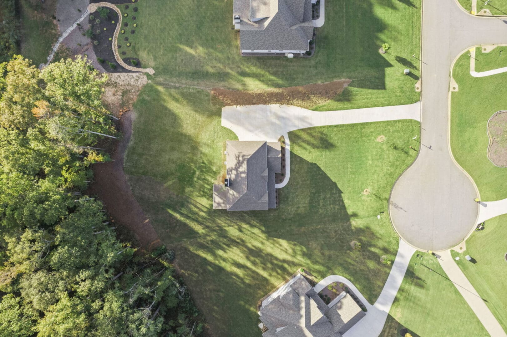 Aerial view of suburban homes and yards.